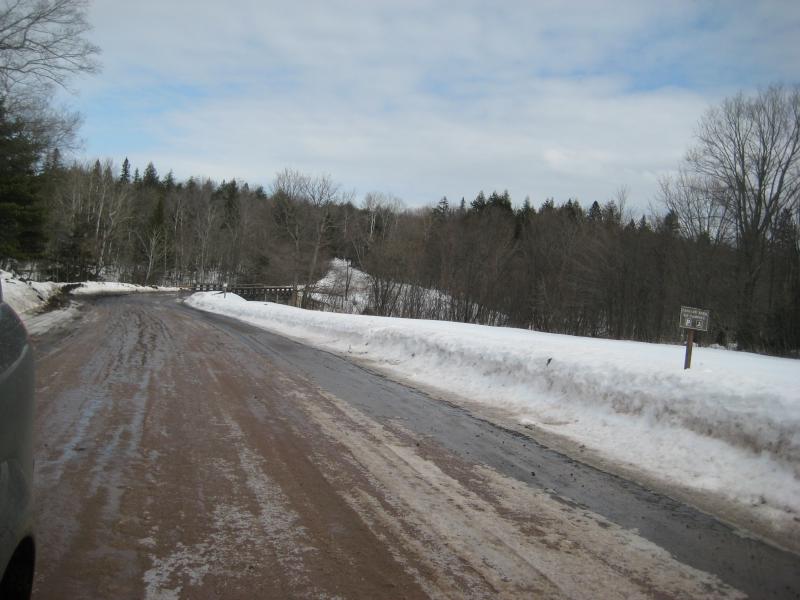 Snowy banks and bridge