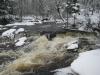 Swollen, tinted waters over Big Ericks Falls