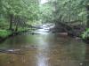 Steady rain over the calm water