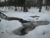 Water peeping out through the snow