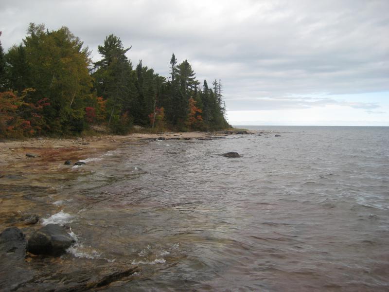 Waves rushing up onto the rocky shoreline