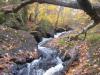 Sliding water between two mounds of rock