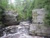 River winding between tall walls