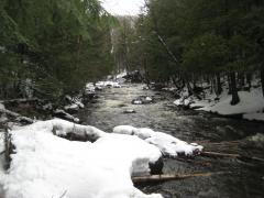 Full river between white banks