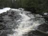 Water falling down the dark rocks