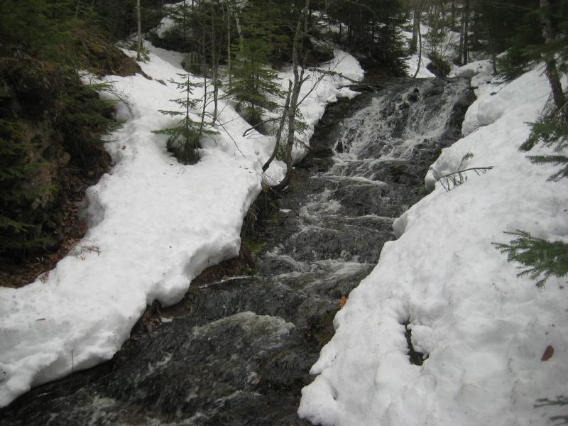 Long slide between snowy rock banks