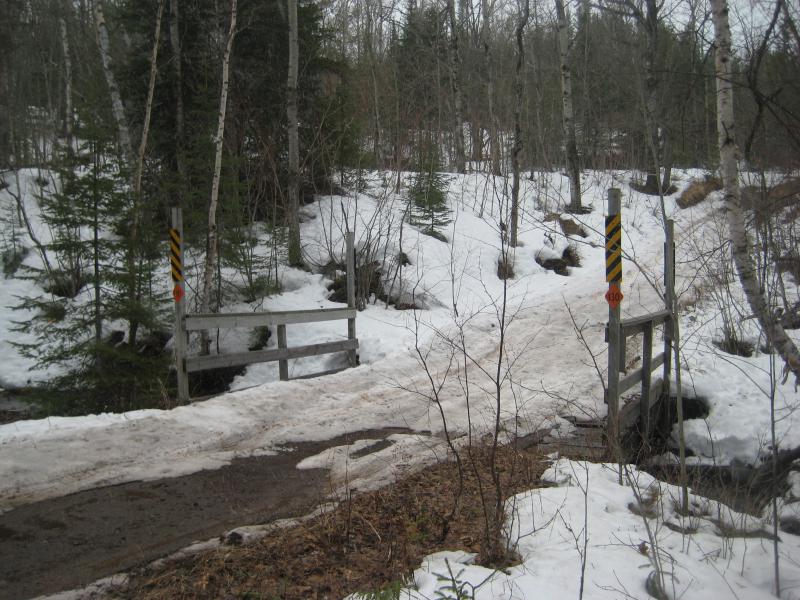 Narrow bridge over the small creek