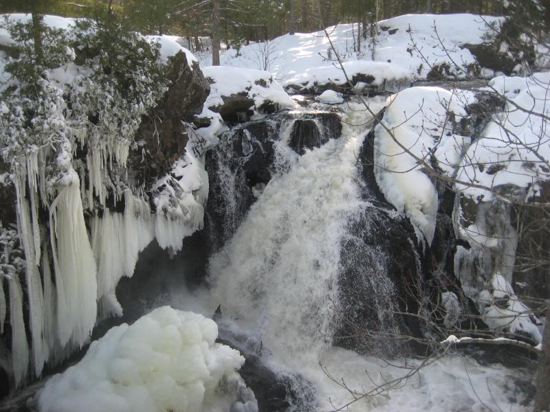 Tall falls surrounded by icicles