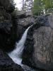 Tall, dark plunge between rocks