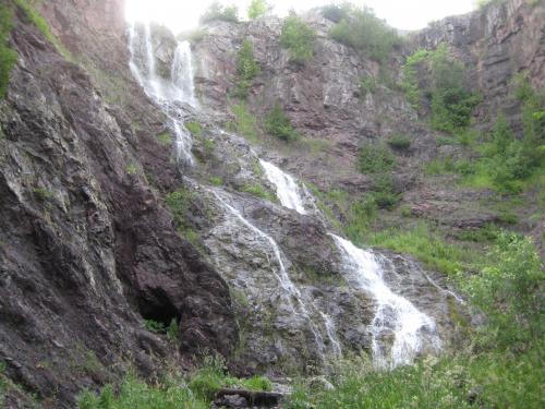 Looking up at the tall waterfall