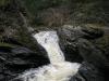 Huron River churning down a steep, narrow chute on