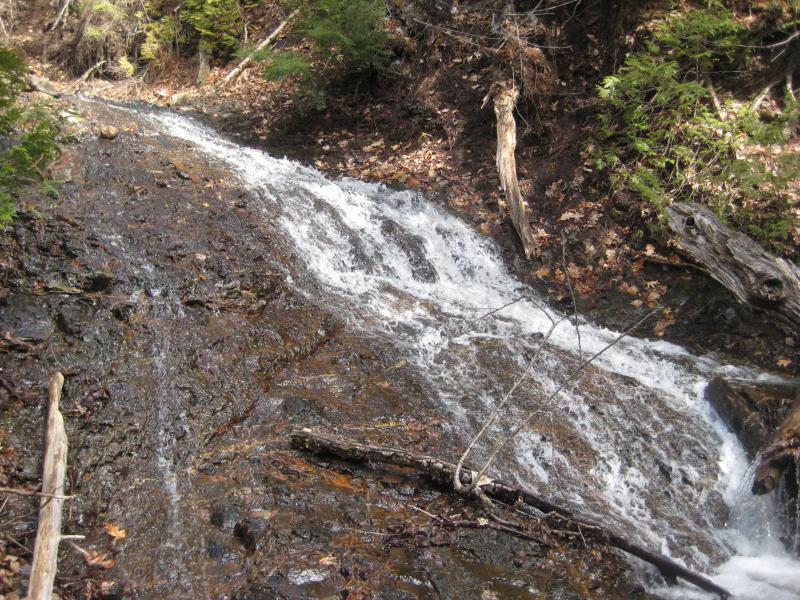 Water fanning out over the rock