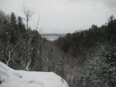 Snowy valley reaching to Torch Lake