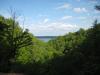 Torch Lake beyond the green valley