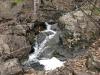 Sideways flow between boulders