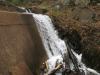 Water streaming down the cement structure