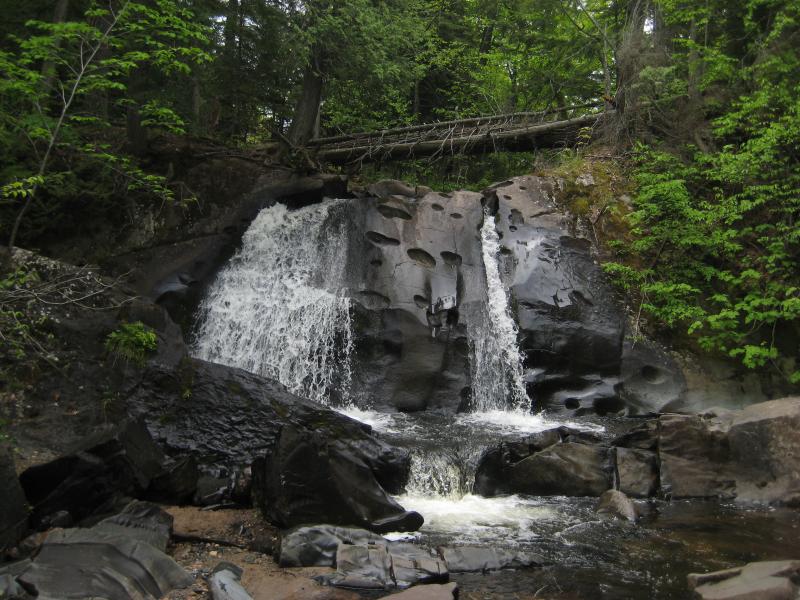 Thin streams of water flowing down the rocks