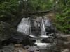 Thin streams of water flowing down the rocks