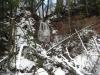 Seasonal waterfall flowing down the sandstone bank