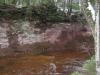 Steep sandstone banks over Little Garlic River