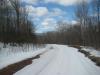 Snowy road going down the hill