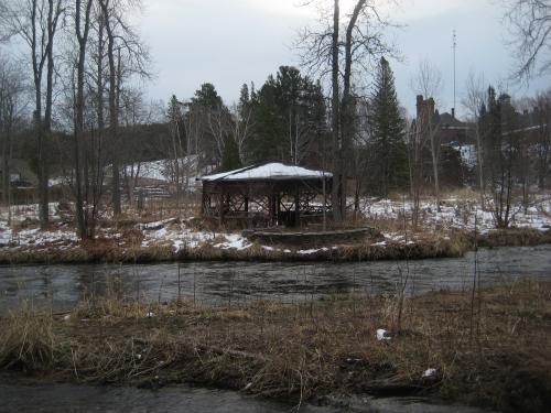 Rotting gazebo across the river