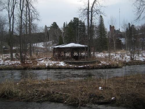 Rotting gazebo across the river