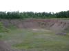 Open grassy pit