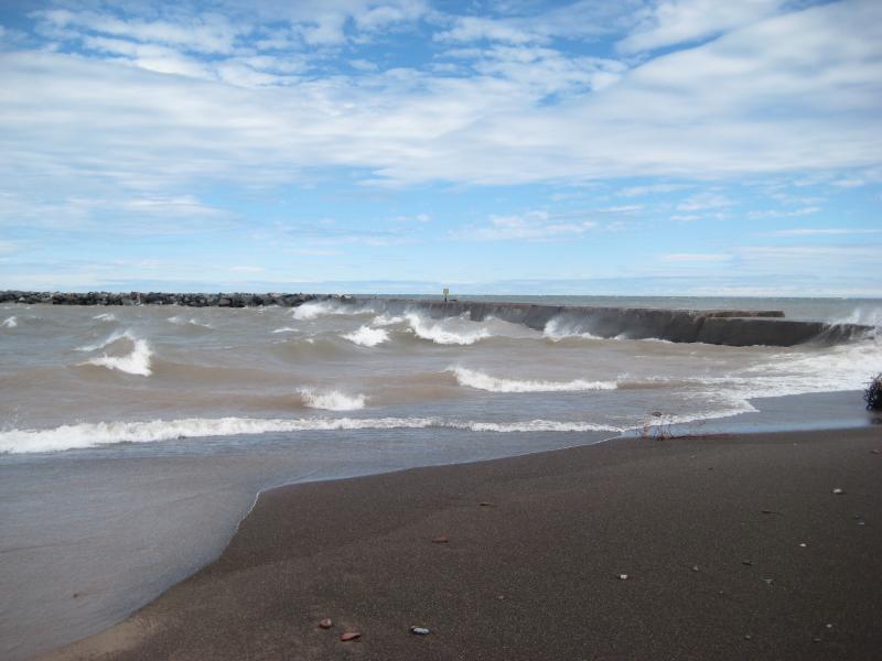 Waves crashing against the breakwater