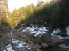 A long shadow cast downstream