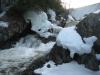 Plunge hiding behind snowy rocks