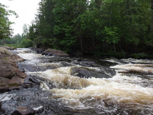 Gushing water between giant rocks