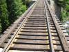 Wooden rail trestle stretching over the river