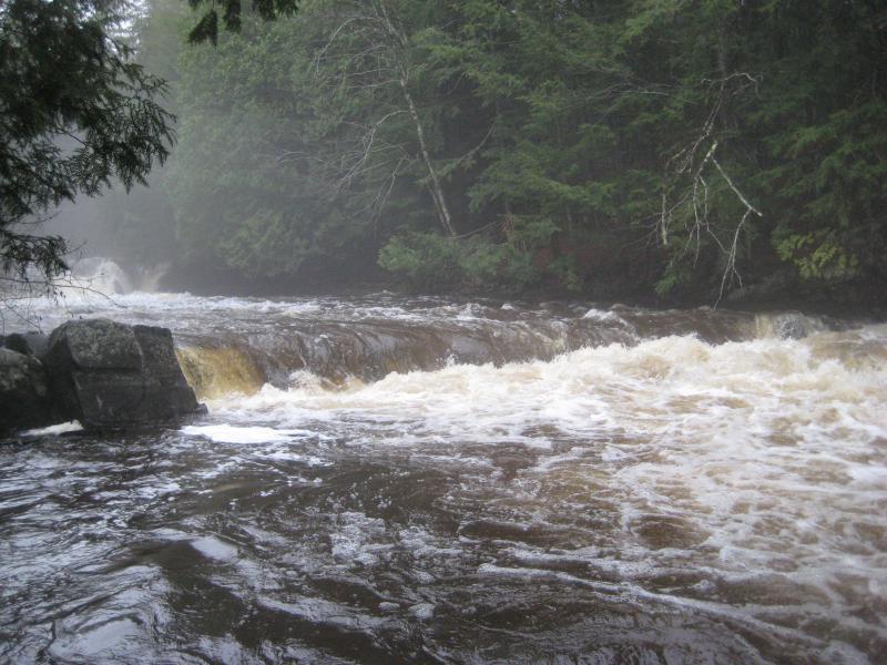 Mist rising above the swollen river