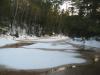 Brown slush over the water