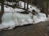 Smooth bumps of ice along the creek bank