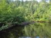 A calm, deep river above the falls