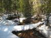Snowy bridge over Plover Creek
