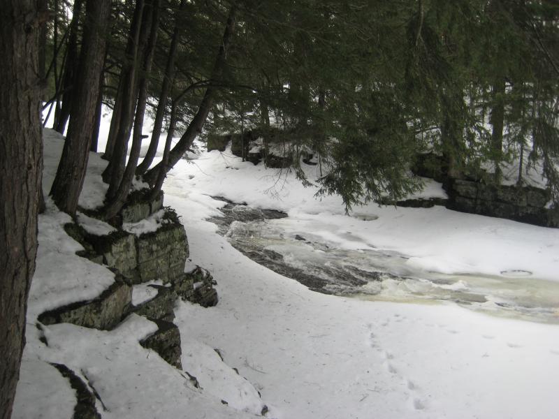 Foaming falls poking through the snow and ice