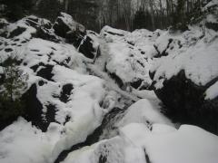 Looking up the snowy chutes