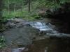 Cascade surrounded by dark rocks