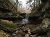 Small dam and tire swing under bare trees