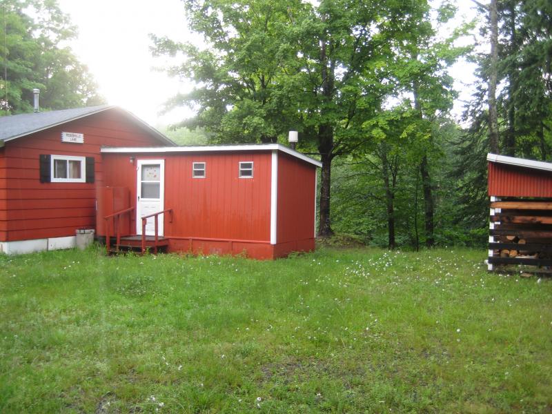 Bright red cabin near the river