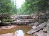 Waterfall or some damp standstone stacks
