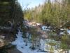 Snowy, muddy creek