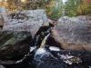 Small drop between massive rocks