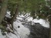 Snow and ice along the banks of the creek