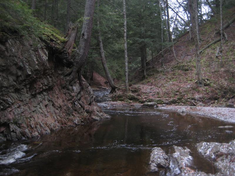 Winding river around sudden rock walls