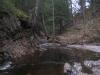 Winding river around sudden rock walls