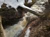 Gushing waterfall under the bridge